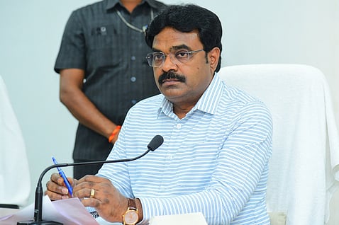 Bapatla collector J Venkata Murali addressing a review meeting on imposing ban on black burley cultivation across the district.