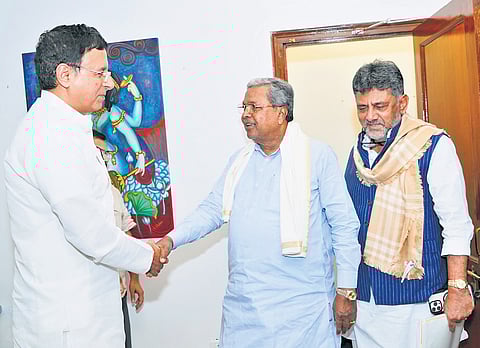Chief Minister Siddaramaiah greets AICC General Secretary Randeep Singh Surjewala in New Delhi on Thursday. DyCM DK Shivakumar is also seen 