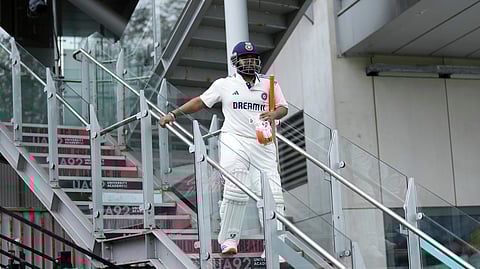 India's Rishabh Pant comes down the stairs with broken foot for batting on the second day at Old Trafford on Thursday