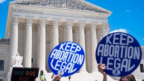 Abortion rights activists and Women's March leaders protest as part of a national day of strike actions outside the Supreme Court, June 24, 2024, in Washington.