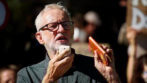 Former British Labour Party leader Jeremy Corbyn addresses activists at a 'climate strike' demonstration in Parliament Square in London, Sept. 24, 2021.