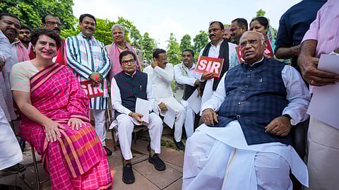 Leader of Opposition in Rajya Sabha Mallikarjun Kharge, Congress MP Priyanka Gandhi Vadra, Samajwadi Party MP Ram Gopal Yadav and other MPs from the INDIA bloc parties protest over the ongoing special intensive revision of electoral rolls in Bihar, during the Monsoon session of Parliament, in New Delhi, Friday, July 25, 2025.