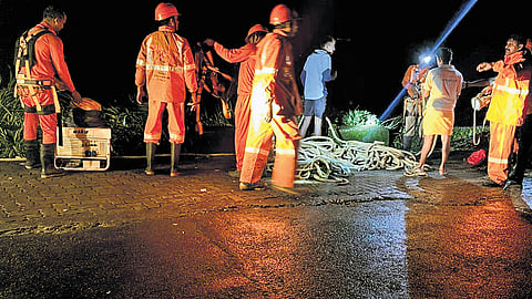 Fire & rescue services personnel trying to recover the body of Thobias from the gorge near Chathanpara in Vagamon on Thursday night