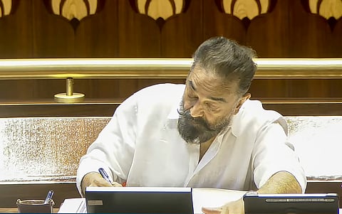 Makkal Needhi Maiam (MNM) leader Kamal Haasan signs documents after taking oath as a member of the Rajya Sabha during the Monsoon session of Parliament, in New Delhi, Friday, July 25, 2025.