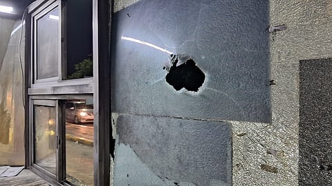 VCK members vandalised the toll booth by damaging its glass panes