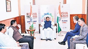CM Mohan Charan Majhi discussing with investors during Odisha TEX 2025 in Bhubaneswar on Friday.