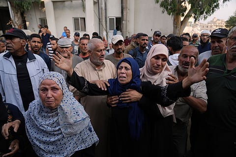 Ahmed Abu Halib carries the body of his 5-month-old baby, Zainab, who died from malnutrition-related causes, according to the family and the hospital, during her funeral outside the Nasser Hospital, in Khan Younis, Gaza Strip, Saturday, July 26, 2025.