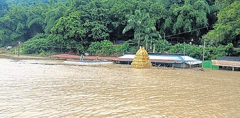 The submerged Gandi Pochamma temple in floodwaters of Godavari river in Devipatnam mandal on Sunday.