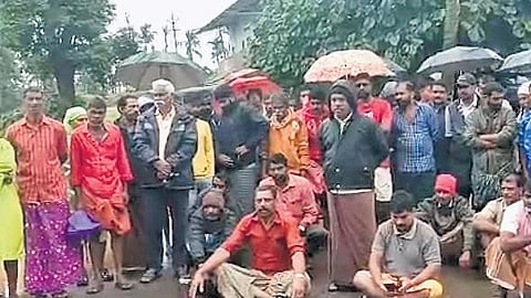 Residents staging a protest demanding measures to prevent elephant intrusion in Ambalamoola 