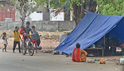 Children playing outside their Jhuggi (slum) near Janakpuri, Delhi.