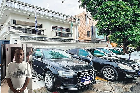 Luxury cars bearing fake diplomatic number plates in front of the illegal embassy in Kavinagar, Ghaziabad, Uttar Pradesh. Inset: Fake diplomat Harsh Vardhan Jain 