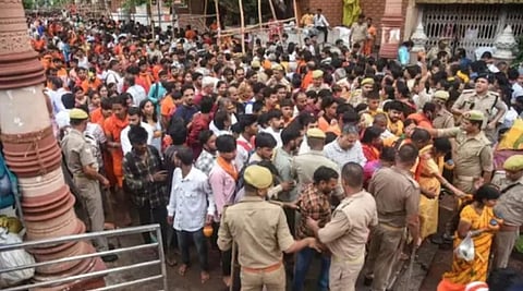 The electric current spread through the tin shed as the wire fell, triggering panic and a stampede in the temple premises.