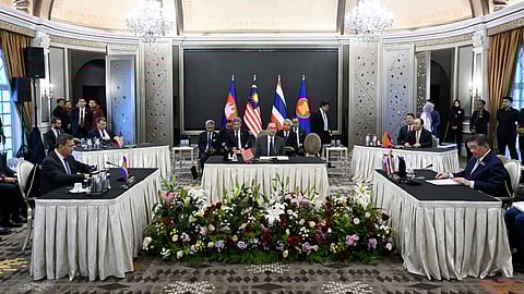 Malaysia's Prime Minister Anwar Ibrahim, center, looks on as Cambodia's Prime Minister Hun Manet, left, and Thailand's acting Prime Minister Phumtham Wechayachai, right, take part in talks on a possible ceasefire between Thailand and Cambodia, in Putrajaya Monday, July 28, 2025.