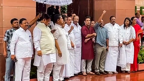 Opposition MPs stage a protest against the ongoing Special Intensive Revision (SIR) in Bihar, during the Monsoon session of Parliament, in New Delhi.