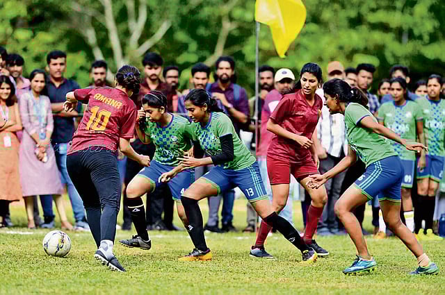 Football teams battling it out during a sporting outing.
