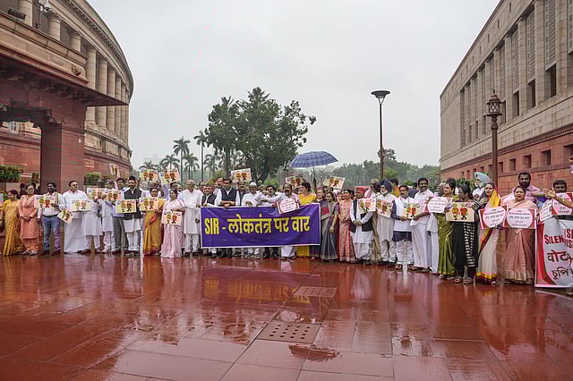 INDIA bloc MP stage a protest against the Election Commission's Special Intensive Revision (SIR) of electoral rolls in Bihar, during the Monsoon session of Parliament, in New Delhi.