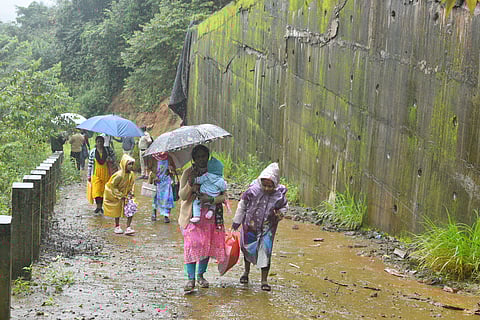 Residents living below the retaining wall are relocating to relief camps after large cracks appeared in the structure, raising fears of a possible collapse.