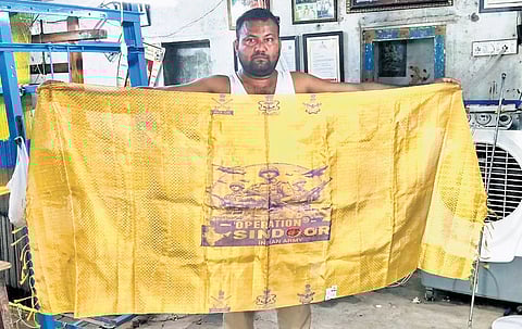 A Sircilla handloom artisan and Handloom Kala Ratna awardee, has created: a miniature golden shawl woven over 25 days, featuring the emblems of the Indian Army, Navy and Air Force.