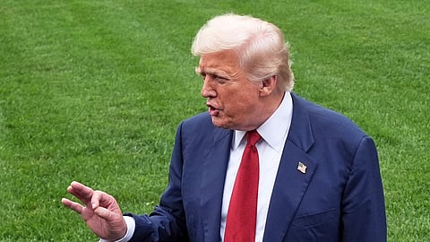 US President Donald Trump speaks with reporters before walking across the South Lawn of the White House to board Marine One en route to Joint Base Andrews, Md., Friday, Aug. 1, 2025, in Washington.