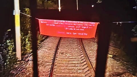 The banner placed by the Maoists on the railway tracks called for a bandh as part of their observance of ‘Shahid Diwas’ (Martyr Week).