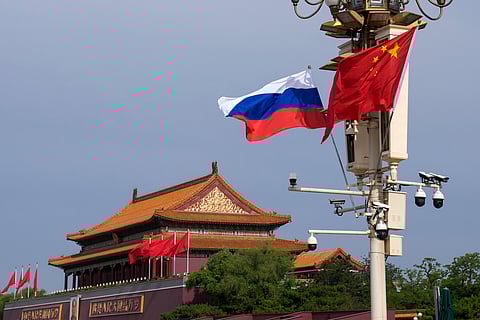 A Russian and Chinese national flag flutter near Tiananmen Gate for the visiting Russia's President Vladimir Putin, in Beijing, May 16, 2024.