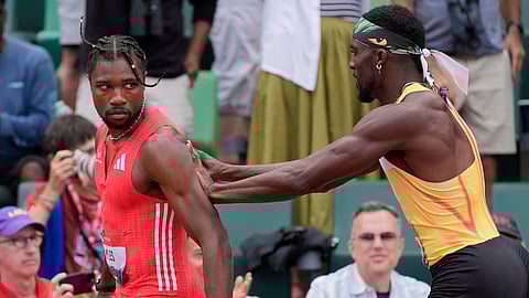 Kenny Bednarek pushes Noah Lyles after the men's 200-meter finals during the U.S. Championships athletics meet in Eugene, Ore.,Sunday, Aug. 3, 2025.