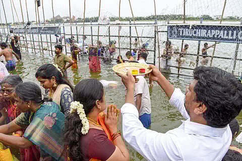 Devotees perform aarthi to the Cauvery river in Srirangam on Sunday, marking Aadi Perukku celebrations across the delta districts.