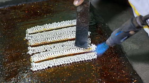 Workers busy making Silver Anklets at a manufacturing unit in Salem.
