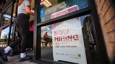 FILE- A sign announces hiring, July 15, 2025, in Richardson, Texas.