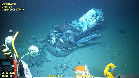 This June 2023 United States Coast Guard still frame from video provided by Pelagic Research Services shows the remains of the Titan submersible, center, on the floor of the Atlantic Ocean.