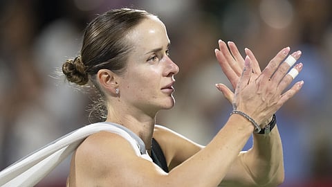 Elina Svitolina of Ukraine acknowledges fans following her loss to Naomi Osaka, of Japan, after their quarterfinal match at the National Bank Open tennis tournament in Montreal, Tuesday, Aug 5, 2025.