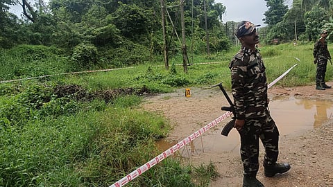 Security personnel deployed at the alleged 13th burial site in Dharmasthala on Wednesday, Aug. 06, 2025.