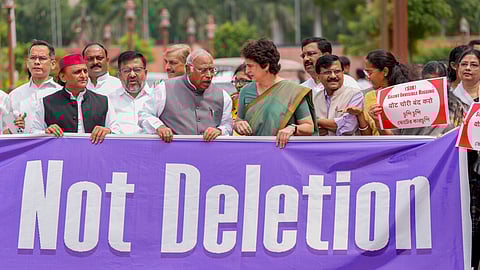 Leader of Opposition in the Rajya Sabha Mallikarjun Kharge, Congress MP Priyanka Gandhi Vadra, Samajwadi Party MP Akhilesh Yadav, Shiv Sena (UBT) MP Sanjay Raut, NCP-SP MP Supriya Sule and other parliamentarians from the INDIA bloc parties at a protest against the Election Commission's Special Intensive Revision (SIR) of electoral rolls in Bihar, during the Monsoon session of Parliament, in New Delhi, Wednesday, Aug. 6, 2025.