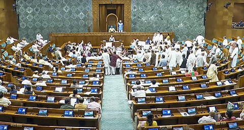Opposition MPs protest in the Lok Sabha during the Monsoon session of Parliament.