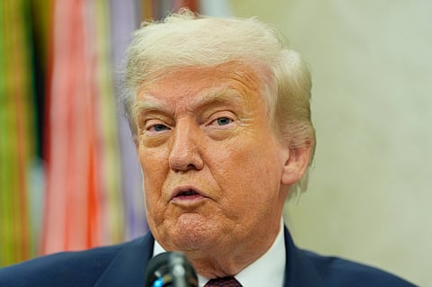 President Donald Trump makes an announcement about Apple in the Oval Office, Wednesday, Aug. 6, 2025, in Washington. 