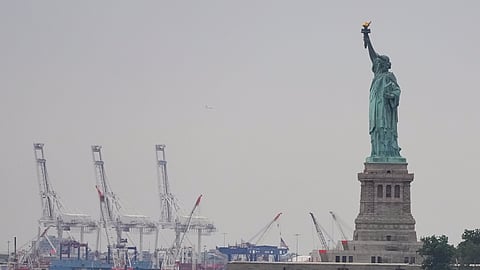 Trump’s new tariffs go into effect as US economy shows signs of strain