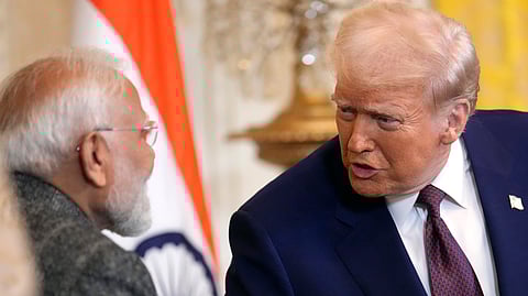 In this photo from Feb. 13, 2025, US President Donald Trump, right, speaks with Prime Minister Narendra Modi during a news conference in the East Room of the White House, in Washington.