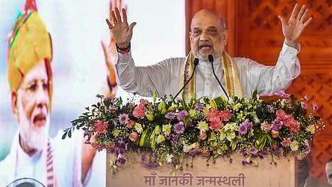 Union Home Minister Amit Shah addresses a public meeting, in Sitamarhi, Bihar, Friday, Aug. 8, 2025. 