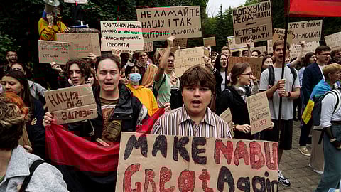 Participants gather at a protest against a law targeting anti-corruption institutions in front of the Ukrainian parliament in Kyiv, Ukraine, Thursday, July 31, 2025.