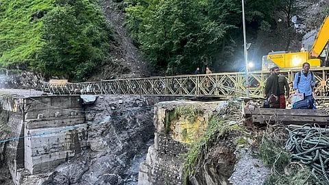 In this image released by @UttarkashiPol via X on Aug. 10, 2025, Construction work underway of the valley bridge near Ganganani, Limchagad on Gangotri National Highway.