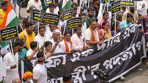 Protestors take part in a march to the West Bengal secretariat 'Nabanna' to mark the completion of one year of the rape and murder of a trainee doctor at RG Kar hospital, in Howrah district of West Bengal, Saturday, Aug. 9, 2025. 