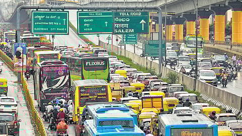 Vehicles move at a snail’s pace during Prime Minister Narendra Modi’s visit to Bengaluru to inaugurate the Yellow Line of the Namma Metro Phase-2 project, on Sunday 