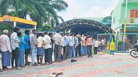 Farmers stand in a queue at Illanthakunta mandal in Rajanna-Sircilla district on Monday to buy urea amid complaints of a shortage 