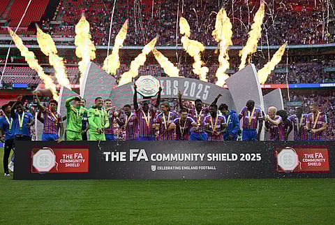 Crystal Palace's players celebrate with the trophy after Palace win the English FA Community Shield football match between Crystal Palace and Liverpool at Wembley Stadium, in London on August 10, 2025. 