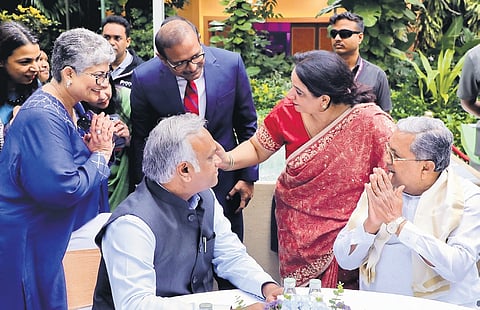 Chief Minister Siddaramaiah and IT-BT Minister Priyank Kharge interact with industry leaders during the curtain raiser of Bengaluru Tech Summit on Monday