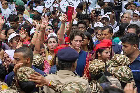 Congress MP Priyanka Gandhi Vadra, TMC MP Sagarika Ghose with others during a protest march by INDIA bloc MPs from Makar Dwar of Parliament to the Election Commission of India office over the poll fraud issue, in New Delhi, Monday.
