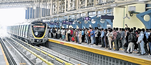 Passengers wait to board a Metro train at the RV Road Metro interchange station during the inaugural run of Yellow Line operations on Monday 