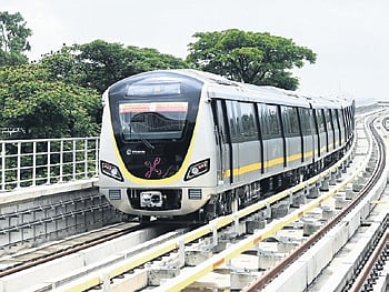 Train approaching the RV Road Metro station on the frist day of its operations in Bengaluru on Monday.