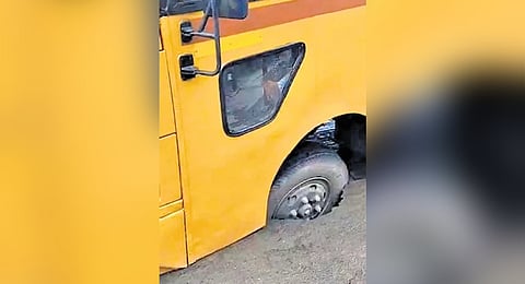The front tyre of the bus that fell into the crater.