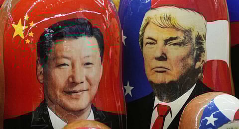  Traditional Russian wooden dolls called Matryoshka depicting China's President Xi Jinping and President Donald Trump at a souvenir shop in St. Petersburg, Russia, Nov. 21, 2024. 